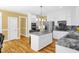 Modern kitchen featuring granite countertops, stainless steel appliances, and island seating at 3604 Thorndike Dr, Wake Forest, NC 27587