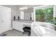 Bathroom featuring granite counters, a soaking tub, and walk-in glass shower at 3604 Thorndike Dr, Wake Forest, NC 27587