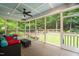 Relaxing screened-in porch with comfortable seating overlooking a private backyard oasis at 3604 Thorndike Dr, Wake Forest, NC 27587