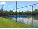 Community tennis courts with new blue surfacing and black chain link fence, offering a space for sports and recreation at 3604 Thorndike Dr, Wake Forest, NC 27587