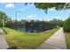 Well-maintained community tennis courts with a fence, offering a great space for sports and recreation at 3604 Thorndike Dr, Wake Forest, NC 27587