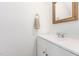 Clean bathroom featuring a white vanity, classic mirror, and neutral-toned walls at 3605 Iron Sight Ct, Raleigh, NC 27616