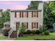 Charming two-story home with red shutters and brick steps leading to a welcoming front entrance at 3605 Iron Sight Ct, Raleigh, NC 27616