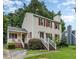 Charming two-story home with red shutters and a cozy front porch, set amidst lush greenery at 3605 Iron Sight Ct, Raleigh, NC 27616