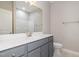 Bathroom featuring a single vanity, mirror and a toilet at 3724 Stevens Chapel Rd, Smithfield, NC 27577
