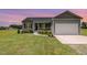 Charming single-Gathering home with attached garage and well-manicured lawn at 3724 Stevens Chapel Rd, Smithfield, NC 27577