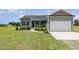 Charming single-Gathering home with attached garage and well-manicured lawn at 3724 Stevens Chapel Rd, Smithfield, NC 27577