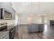 Modern kitchen with stainless steel appliances, granite countertops, and a center island at 3724 Stevens Chapel Rd, Smithfield, NC 27577
