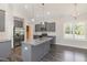 Modern kitchen with stainless steel appliances, granite countertops, and a center island at 3724 Stevens Chapel Rd, Smithfield, NC 27577