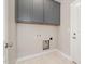 Practical laundry area with upper storage cabinets at 3724 Stevens Chapel Rd, Smithfield, NC 27577