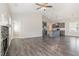 Open-concept living room featuring a fireplace, high ceilings, and hardwood floors at 3724 Stevens Chapel Rd, Smithfield, NC 27577