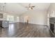 Open-concept living room featuring a fireplace, high ceilings, and hardwood floors at 3724 Stevens Chapel Rd, Smithfield, NC 27577