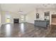 Open-concept living room featuring a fireplace, high ceilings, and hardwood floors at 3724 Stevens Chapel Rd, Smithfield, NC 27577