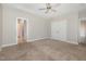 Large bedroom with a ceiling fan and carpet flooring at 3724 Stevens Chapel Rd, Smithfield, NC 27577