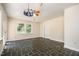 Cozy bedroom featuring slate flooring, a ceiling fan, and bright natural light from a large window at 420 Lipscomb Grove Church Rd, Hillsborough, NC 27278