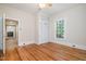 Bedroom with hardwood floors and built-in closet at 420 Lipscomb Grove Church Rd, Hillsborough, NC 27278