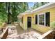 Exterior of a yellow home with black shutters and a wooden deck at 420 Lipscomb Grove Church Rd, Hillsborough, NC 27278