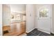 Bright foyer with hardwood floors, white trim, and a welcoming front door at 420 Lipscomb Grove Church Rd, Hillsborough, NC 27278
