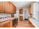 Kitchen with wooden cabinetry, stylish countertops, and seamless flow to the adjacent spaces at 420 Lipscomb Grove Church Rd, Hillsborough, NC 27278