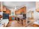 Well-lit kitchen featuring wooden cabinets, butcher block countertops, and modern appliances at 420 Lipscomb Grove Church Rd, Hillsborough, NC 27278