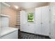 Functional mudroom with built-in cabinets, shelving, countertop, and attractive slate flooring at 420 Lipscomb Grove Church Rd, Hillsborough, NC 27278