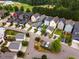 A view of homes in a planned community with lawns and nearby baseball field at 426 Granite Mill Blvd, Chapel Hill, NC 27516