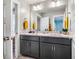 Bathroom with double sinks, modern fixtures, a large mirror, and clean lines at 426 Granite Mill Blvd, Chapel Hill, NC 27516