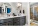 Modern bathroom with double vanity, elegant mirrors, stylish fixtures, and a glass-enclosed shower at 426 Granite Mill Blvd, Chapel Hill, NC 27516
