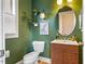 Stylish half bath features a wood vanity, modern fixtures, and tasteful decor at 426 Granite Mill Blvd, Chapel Hill, NC 27516