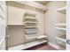 Walk-in closet featuring adjustable shelving, wire baskets, and ample storage space for organization at 426 Granite Mill Blvd, Chapel Hill, NC 27516