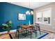 Dining room featuring a modern chandelier, a wood table, and stylish decor at 426 Granite Mill Blvd, Chapel Hill, NC 27516