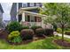 Attractive home showcasing lush landscaping and a welcoming front porch at 426 Granite Mill Blvd, Chapel Hill, NC 27516