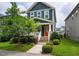 Charming home featuring a bright red front door and beautifully landscaped yard at 426 Granite Mill Blvd, Chapel Hill, NC 27516