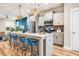 Modern kitchen featuring a large island with seating, granite countertops and stainless appliances at 426 Granite Mill Blvd, Chapel Hill, NC 27516