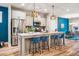 Modern kitchen featuring a large island with seating and stainless steel appliances at 426 Granite Mill Blvd, Chapel Hill, NC 27516
