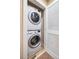 Convenient, stacked washer and dryer set in a closet with bi-fold doors at 426 Granite Mill Blvd, Chapel Hill, NC 27516