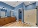 This bathroom has a walk in shower, long vanity with double sinks and wood laminate floors at 4511 Crab Creek Dr # 101, Raleigh, NC 27612