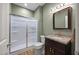 Full bathroom with a frosted glass shower and modern sink with a dark vanity at 4511 Crab Creek Dr # 101, Raleigh, NC 27612