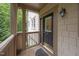 Cozy porch leads to the front door featuring glass panes and the address number at 4511 Crab Creek Dr # 101, Raleigh, NC 27612