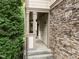 Welcoming covered front porch with stone accents and lush greenery at 4511 Crab Creek Dr # 101, Raleigh, NC 27612