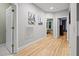 Hallway features hardwood floors, access to bedrooms and living spaces at 4511 Crab Creek Dr # 101, Raleigh, NC 27612