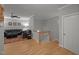 Living room featuring hardwood floors, gray walls, a staircase, and comfortable seating at 4511 Crab Creek Dr # 101, Raleigh, NC 27612
