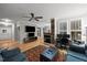 Spacious living area featuring hardwood floors, fireplace and shutters for ample lighting at 4511 Crab Creek Dr # 101, Raleigh, NC 27612