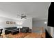 Living area featuring hardwood floors, comfortable seating, and a ceiling fan at 4511 Crab Creek Dr # 101, Raleigh, NC 27612