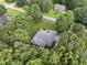 Aerial view of a home with mature trees and a well-manicured lawn at 517 Belmont Cir, Wake Forest, NC 27587