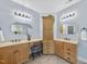 Bright bathroom with double sinks, custom cabinetry, and a dedicated vanity area at 517 Belmont Cir, Wake Forest, NC 27587
