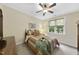 Inviting bedroom featuring a ceiling fan and a sun-drenched window at 517 Belmont Cir, Wake Forest, NC 27587