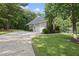 Exterior of home showing the long driveway leading to a three-car garage at 517 Belmont Cir, Wake Forest, NC 27587