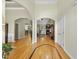 Inviting foyer with hardwood floors, arched doorways, and views into the living spaces at 517 Belmont Cir, Wake Forest, NC 27587
