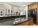 Granite countertop with breakfast bar overlooking living area at 517 Belmont Cir, Wake Forest, NC 27587
